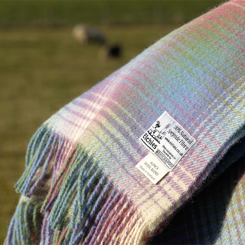 Close-up of Elchies 100% Natural Speyside Fibre Blanket in the shade "Borealis". 