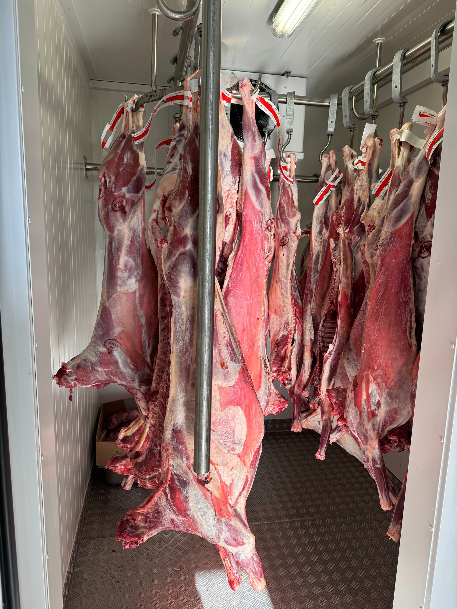 Goat carcasses hanging in the Elchies onsite butchery.