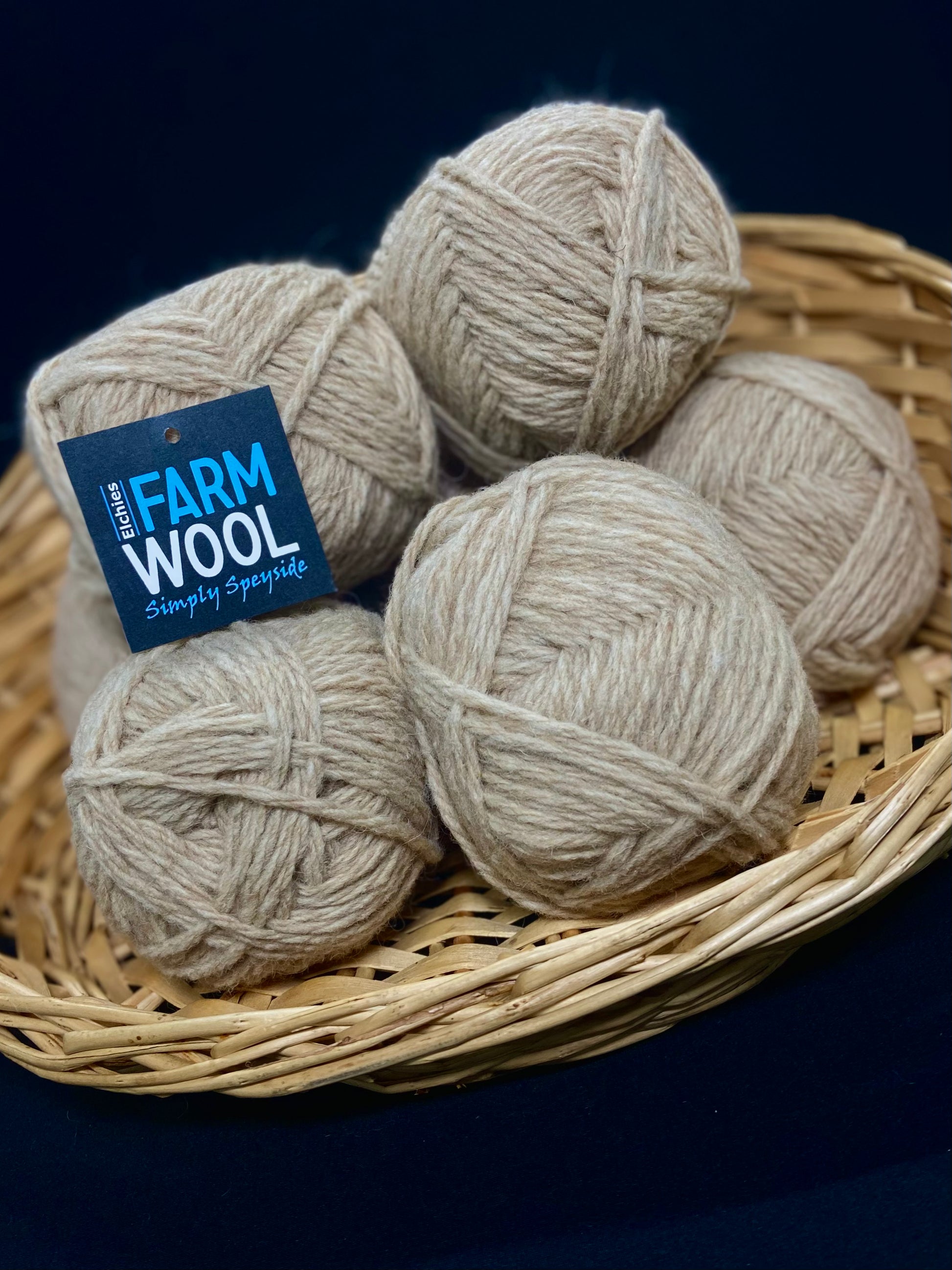 A basket of Elchies Farm Wool Hanks in the shade 'Fawn'.