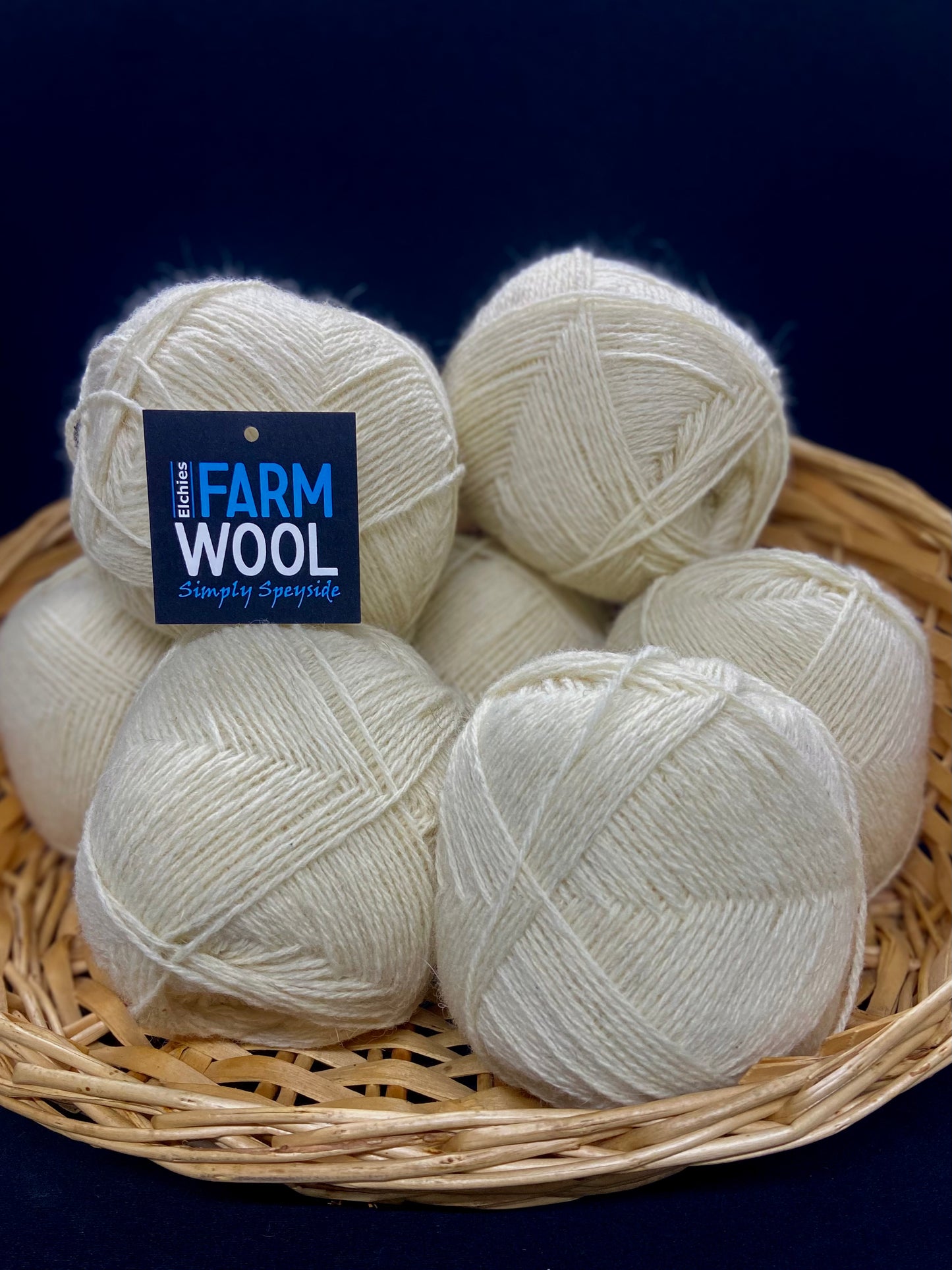 A basket of Elchies Farm Wool Balls in the shade 'Natural'.